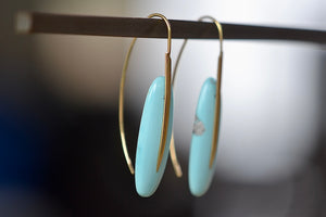 Side view of Feather Earrings in Turquoise with natural inclusions and 18k gold hooks by Rachel Atherley.