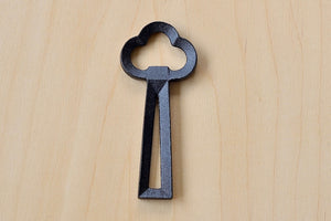 Upright view of Cast Iron Clover Beer and Soda bottle opener made in Japan.