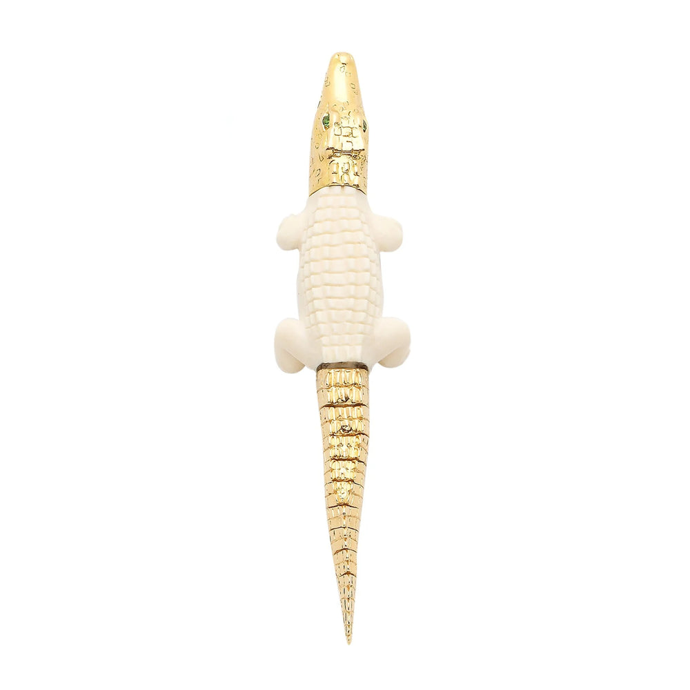 Alligator Bite earring by Bibi Van Der Velden in mammoth tusk..