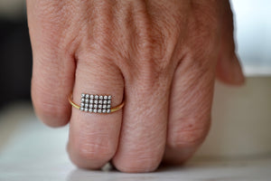 Wearing the Charnières Rectangular Ring turned up designed by Yannis Sergakis. 