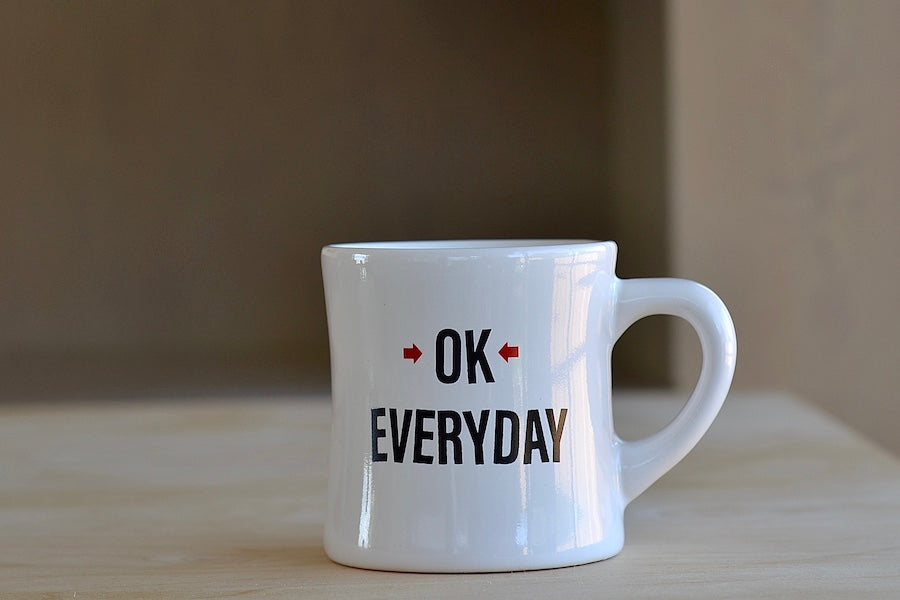 The OK mug is a large ceramic diner mug with "OK EVERYDAY" written on one side and our logo on the other. Los Angeles. Made in the USA.