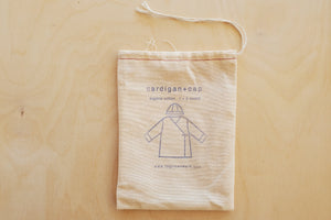 Baby Cardigan and Cap by Fog Linen.