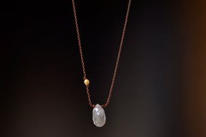
            
                Load image into Gallery viewer, A raw and faceted gray diamond is accented with an 18k gold bead on poly nylon string to form this one of a kind organic necklace. Designed by Margaret Solow. 
            
        