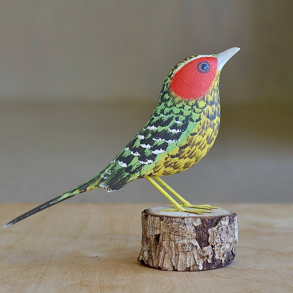 Red spotted woodpecker bird sculpture.