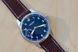 
            
                Load image into Gallery viewer, Weiss Watch 42mm Standard Field Watch with Navy Blue Dial, shown with brown Horween leather strap is manually wound, made with American parts, featuring Super Luminova hands and markers.
            
        