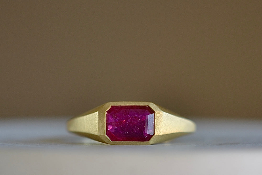 Ruby Signet by Elizabeth Street in size 7 with tapered matte 18k gold band. 