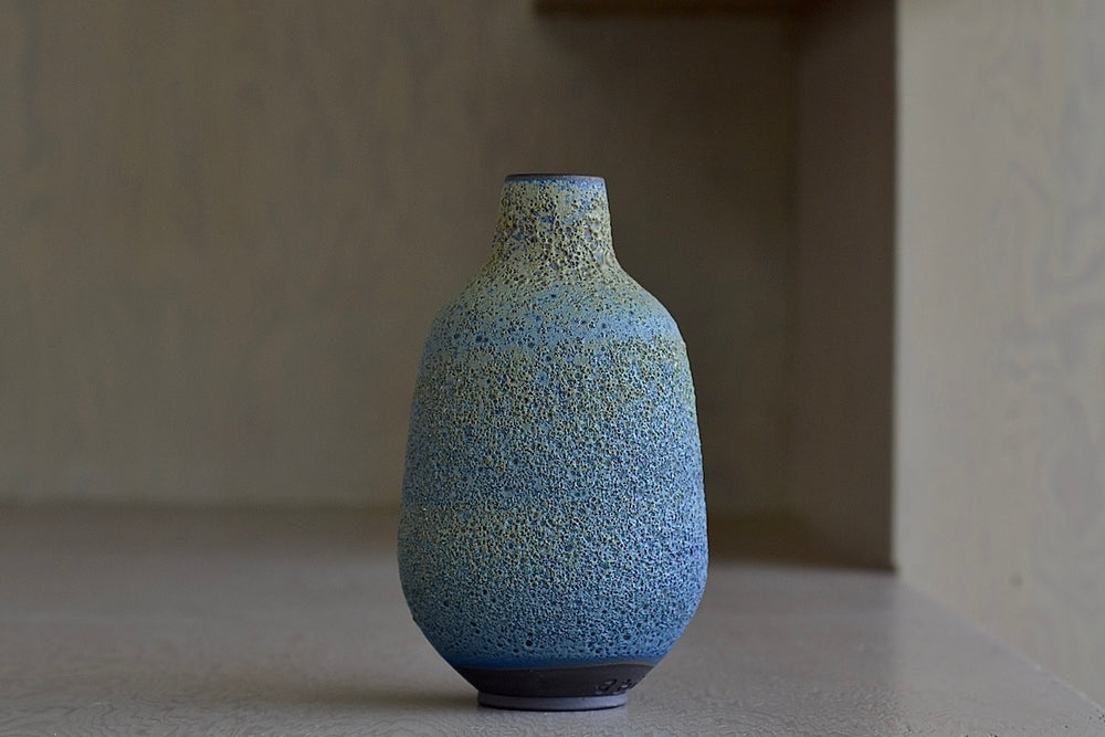 Heather Rosenman Medium Blue with Yellow Volcanic Vase is a one of a kind ceramic piece.