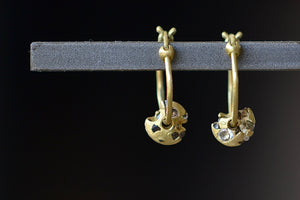 Polly Wales Diamond Spinner Small Hinge closure Hoop Earrings  are A hinge lock hoop in 18k gold with an attached disc, speckled with mixed diamonds around the circumference for a beautiful confetti-like appearance. Recycled gold. 