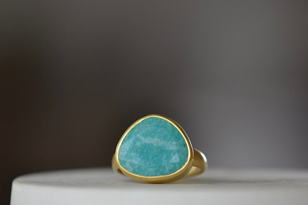 Large Greek ring in Amazonite by Pippa Small Jewellery is an organically shaped, hand cut and faceted amzonite set in 18k yellow gold. Size 6.5 in stock.