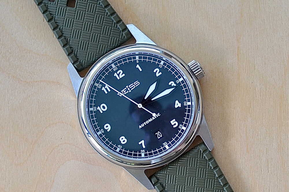 Weiss Watch 38mm Automatic Field Watch with Black Dial and date, shown with  olive rubber strap , made with American parts, featuring Super Luminova hands and markers. 