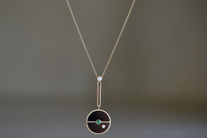 
            
                Load image into Gallery viewer, Signature Compass Pendant with Black Onyx and emerald by Retrouvai is a pendant necklace with stone inlay that is accented with a center gem stone and a white diamond.
            
        