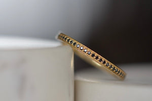 
            
                Load image into Gallery viewer, Black Diamond Stackable Eternity Band by Lizzie Mandler is a  one of a kind classic eternity band with beautiful black diamond pave and a white enamel edge inset  on top and bottom. Handcrafted in Los Angeles.
            
        