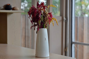 Hyejong Kim Tall White Pinched vase with short crease made in Seoul, Korea is a Hand thrown porcelain in matte white glaze. Signed and one of a kind. Loewe Craft Prize Finalist.