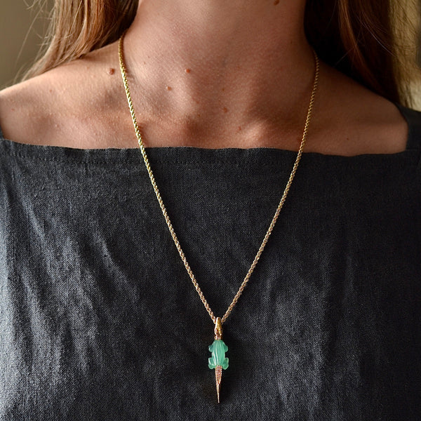 Wearing the alligator Bite earring in chrysoprase by Bibi Van Der Velden with tsavorite eyes on a gold box chain as a charm.