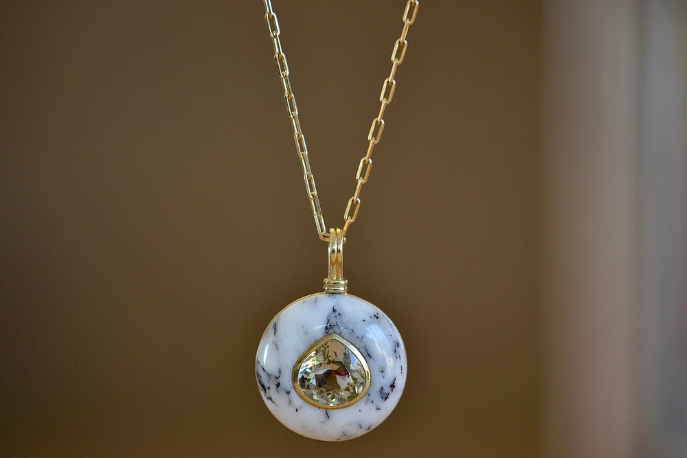 
            
                Load image into Gallery viewer, The large lollipop necklace in opalized dendrite by Retrouvai is a one of a kind pendant featuring a chunky and rounded stone face with a translucent center stone set on a generous chain. This one is opalized dentrite with a pear cut yellow tourmaline .
            
        