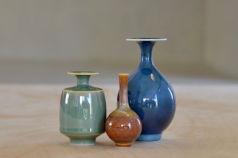 
            
                Load image into Gallery viewer, Miniature Hand Thrown Ceramic Vase Trio in Blue, Green and Brown by Yuta Segawa.
            
        