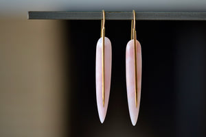 
            
                Load image into Gallery viewer, The Rachel Atherley Feather Earrings in Pink Opal are One of a kind articulating and tapered feather shaped slices of pink opal hang on 18k yellow gold ear wire hooks that extend as a sword or spear and form these earrings.
            
        