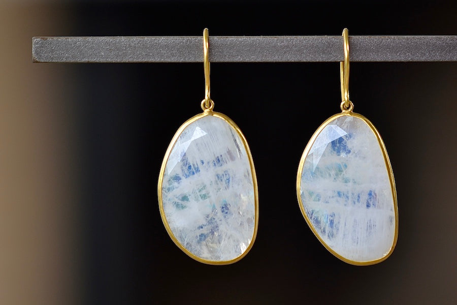 First Frost Large Single Moonstone Drop Earrings by Pippa Small are translucent, lightly faceted and bezel set stones on ear wire in 18k yellow gold.