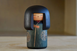 
            
                Load image into Gallery viewer, An artisan vintage Kokeshi doll wearing a kimono.  Handmade in Japan by Sekiguchi Sansaku (1925-2018). This one is stamped.
            
        