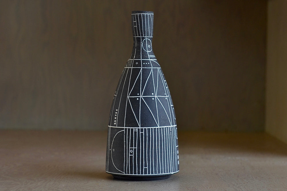 
            
                Load image into Gallery viewer, Heather Rosenman &amp;quot;Scribe&amp;quot; vase in brown with white sgraffito patterns is a hand thrown stoneware vase by Heather Rosenman.
            
        