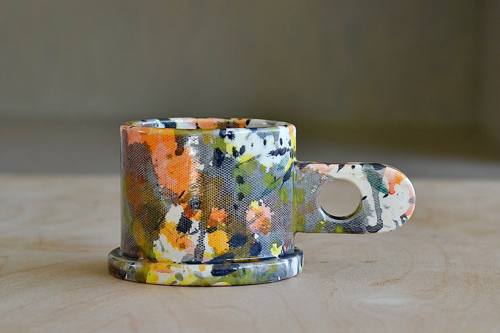 EXP standard splatter mug in gray with orange and black by Peter Shire and Echo Park Pottery.