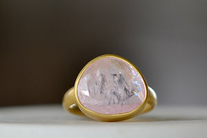 The Morganite Large  Greek Ring by Pippa Small Jewellery is an organically shaped, and hand cut, light pink, faceted and translucent morganite set in 18k yellow gold. Size 7.5 in stock.