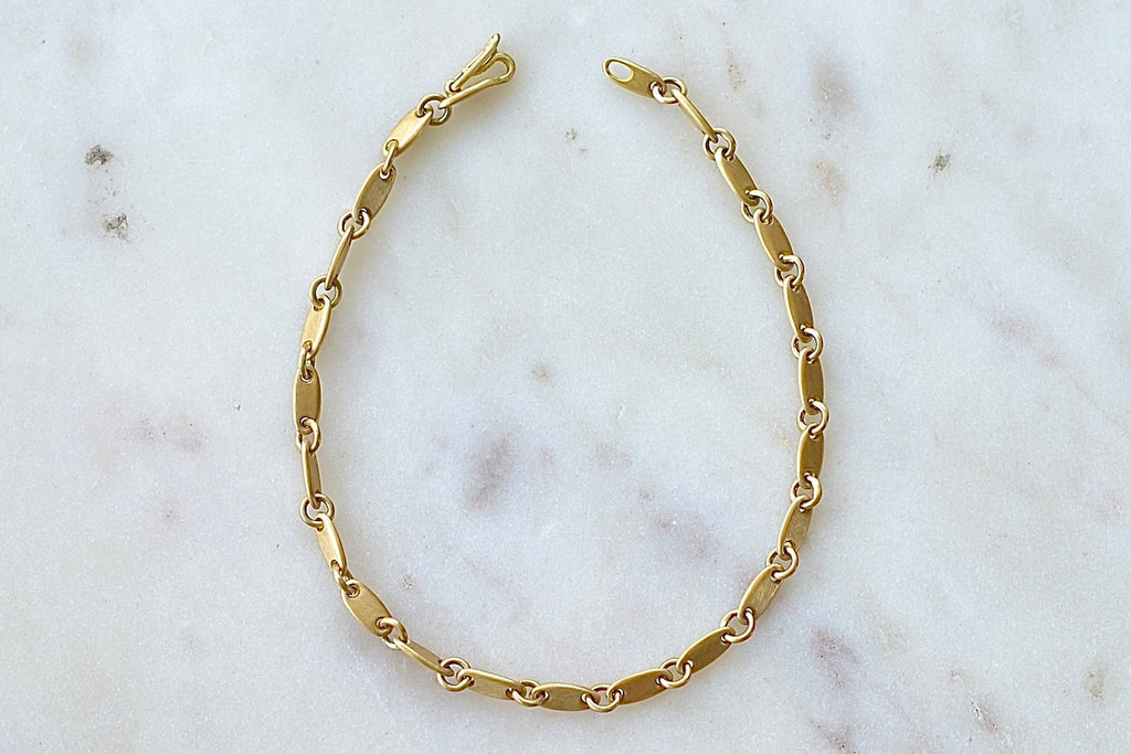 Rain Chain Short Line Bracelet is an 18k yellow gold bracelet by Marain Maurer.