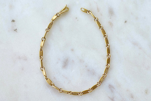 Rain Chain Short Line Bracelet is an 18k yellow gold bracelet by Marain Maurer.