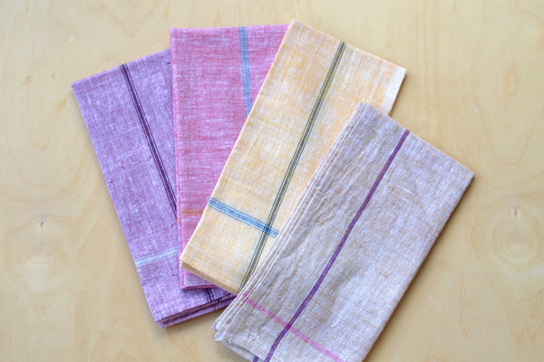 Dosa assorted color napkins are designed by Christina Kim for Lulu Restaurant at the Hammer Museum. Woven by a Khadi cotton cooperative in Rajsitapour, India, each set includes one napkin in each color and come in a paper bag with a Lulu sticker.