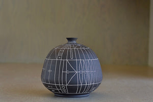 The HR 400 'Scribe" vase is a ceramic  hand thrown stoneware vase with sgraffito patterns by Heather Rosenman. 