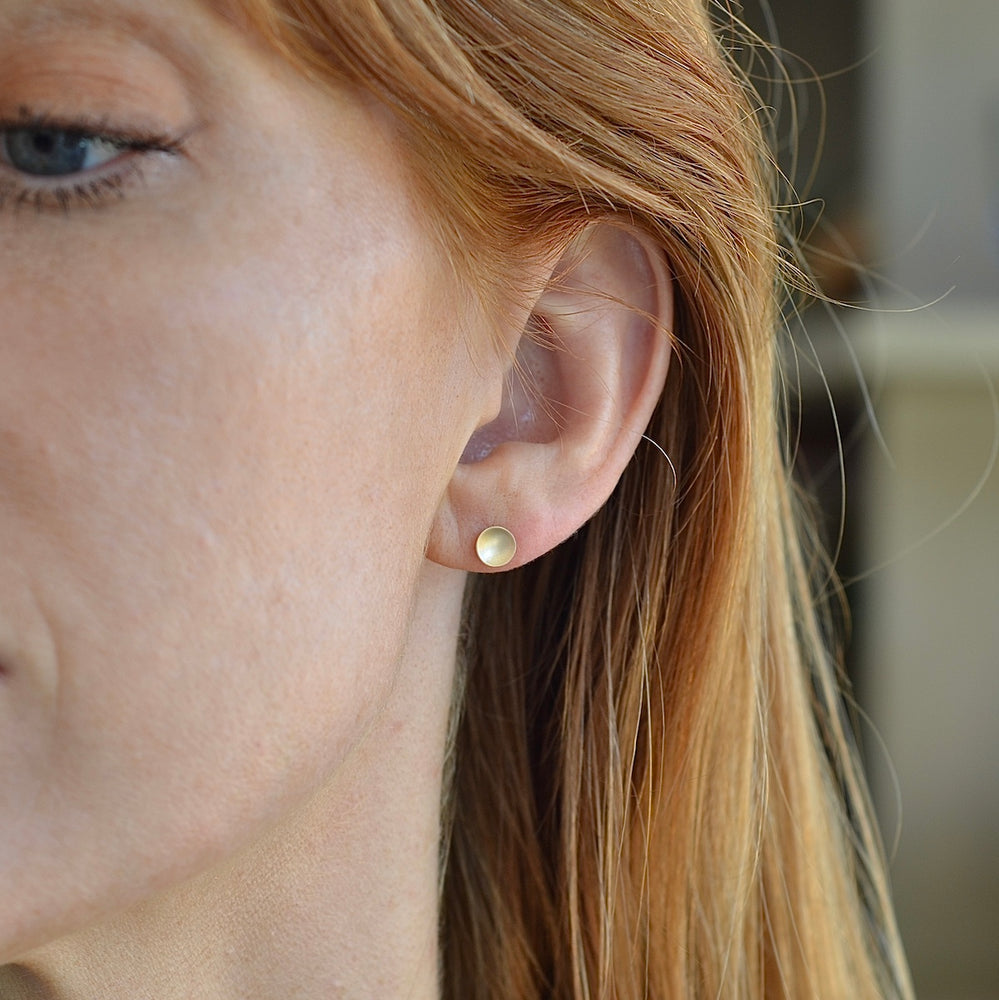 Medium polka dot earrings shown worn.