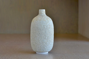 Hand thrown oval Vase in Cream to white Volcanic Glaze by Heather Rosenman.