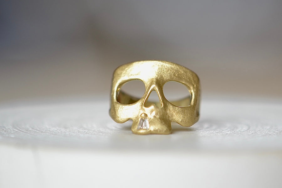 Mini Snaggle Tooth Skull ring by Polly Wales with baguette diamond snaggle tooth.