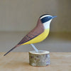 Great Kiskadee wood bird sculpture.