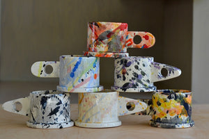 A selection of EXP standard splatter mugs by Peter Shire and Echo Park Pottery.