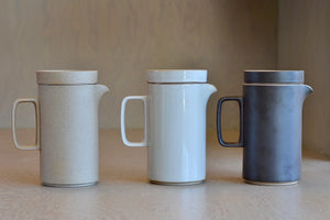
            
                Load image into Gallery viewer, Side view of all three color ways of the tall Hasami teapot, showing Natural, gray and black.
            
        