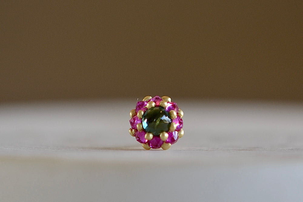
            
                Load image into Gallery viewer, Larkspur stud earring by Polly Wales is a single earring is a smaller floral cluster made out of a half sphere in gold with a cabochon and encrusted inverted brilliant sapphires. We have one in green and pink
            
        