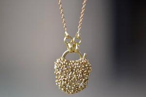 Close up of Small River Diamond Baguette Fuzzy Pave Petite "Coeur de Fantasie" Padlock Necklace designed by Polly Wales.
