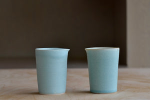 
            
                Load image into Gallery viewer, Flair Mug, Mugs, tumbler by Hyejeong Kim a potter and ceramicist, and  Loewe Craft Prize 2020 finalist from Korea. Each one is one of a kind and slightly different in size and shape, but each one is ultimately all about the hand. Great to hold in celadon blue glaze available at OK. 
            
        