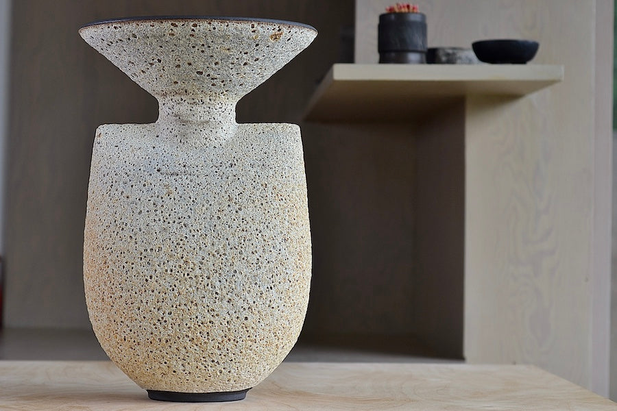 
            
                Load image into Gallery viewer, Hand thrown tall stoneware vase in Artemis shape with volcanic lava glaze in tan by Heather Rosenman Ceramics.
            
        