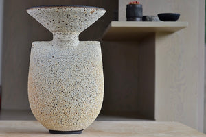 
            
                Load image into Gallery viewer, Hand thrown tall stoneware vase in Artemis shape with volcanic lava glaze in tan by Heather Rosenman Ceramics.
            
        