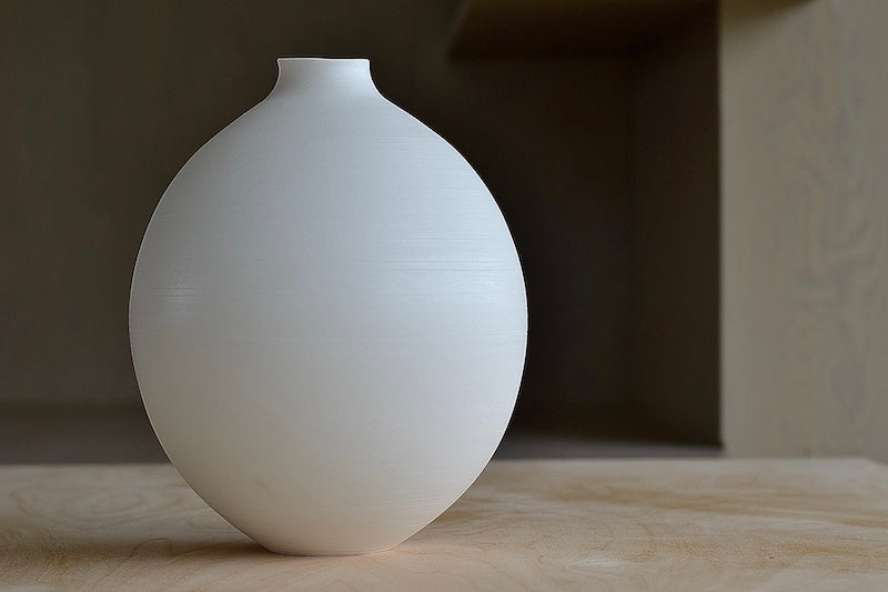 
            
                Load image into Gallery viewer, Lilith Rockett Large Round Vase is wheel thrown porcelain with gloss glaze on the interior and an unglazed exterior.
            
        