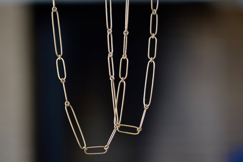 Long and short 14k gold paperclip chains (necklaces) with two short, one long flat clips in 15 or 17 inches by Kaylin Hertel.