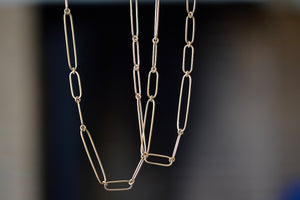 Long and short 14k gold paperclip chains (necklaces) with two short, one long flat clips in 15 or 17 inches by Kaylin Hertel.