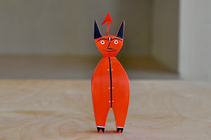 
            
                Load image into Gallery viewer, The Wooden Little Devil is a bright red decorative figurine that is part of the Alexander Girard doll collection. Hand painted and priduced by Vitra. 
            
        