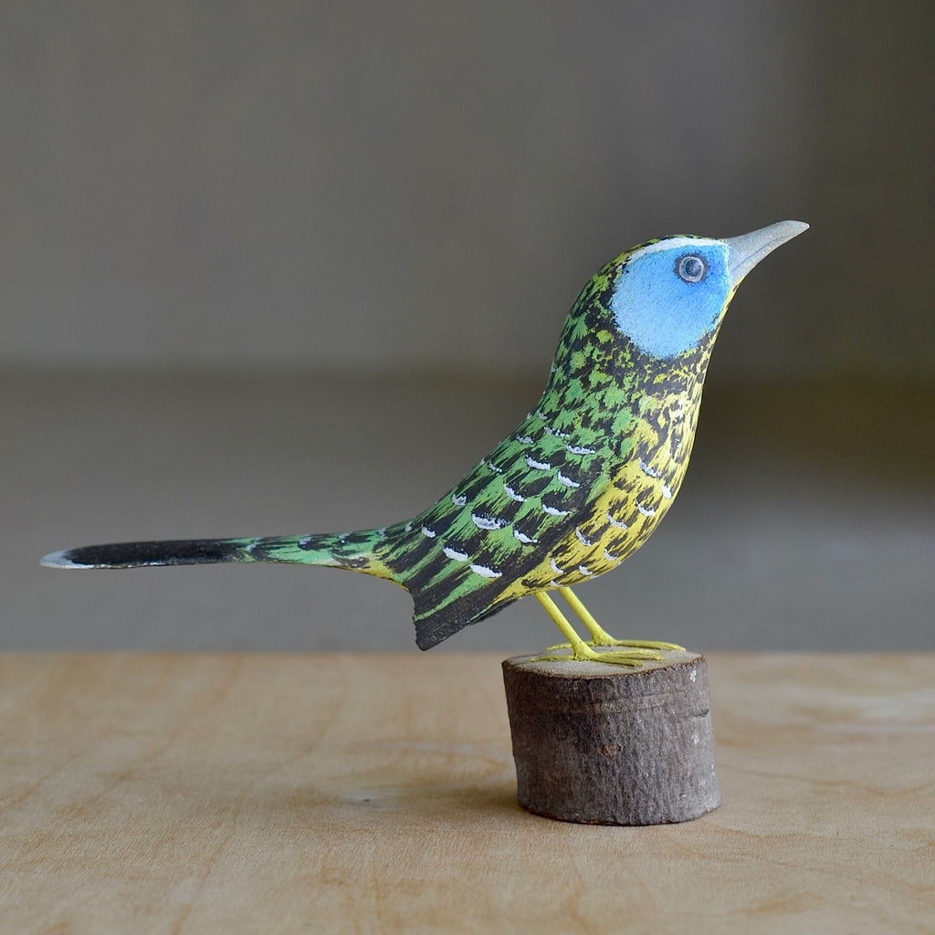 Blue spotted woodpecker bird sculpture.