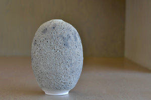 Heather Rosenman oval ceramic vase in gray to white volcanic glaze.