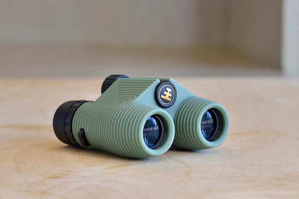 
            
                Load image into Gallery viewer, Side view of Standard Issue Binoculars 10x25 in Sage Green by Nocs. 
            
        