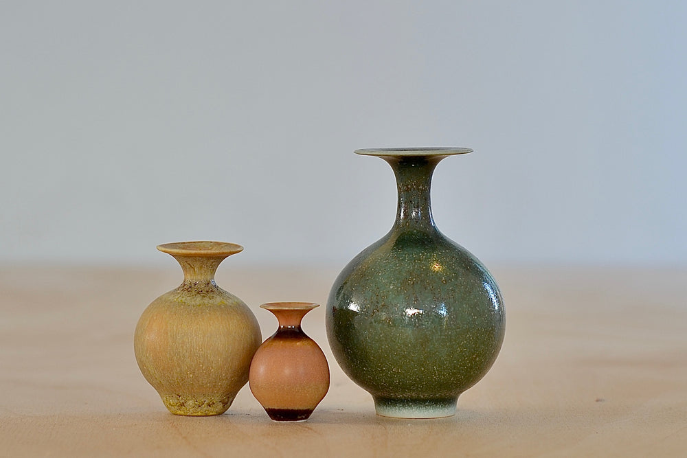 
            
                Load image into Gallery viewer, Miniature Hand Thrown Ceramic Vase Trio in Green, Ochre and Orange by Yuta Segawa on white background..
            
        