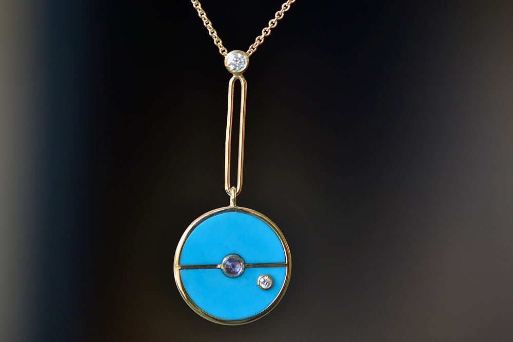 
            
                Load image into Gallery viewer, Close up of Compass Pendant in Turquoise and Tanzanite by Retrouvai.
            
        